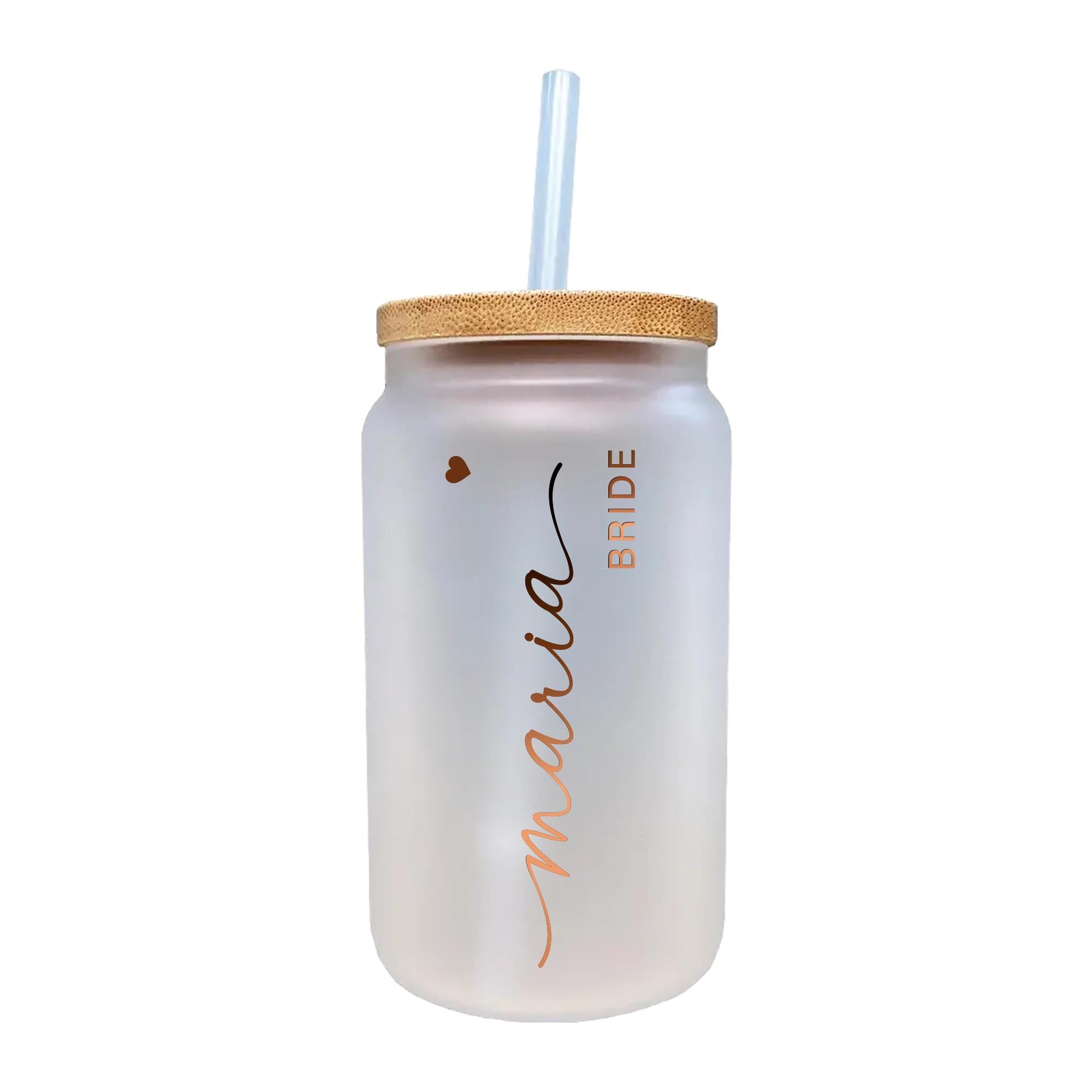 a white mason jar with a straw in it