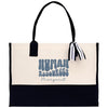 A beige tote bag with a black handle and a black and white striped ribbon tied around it. The bag has a logo printed on it that says "Human Resources Margaret".