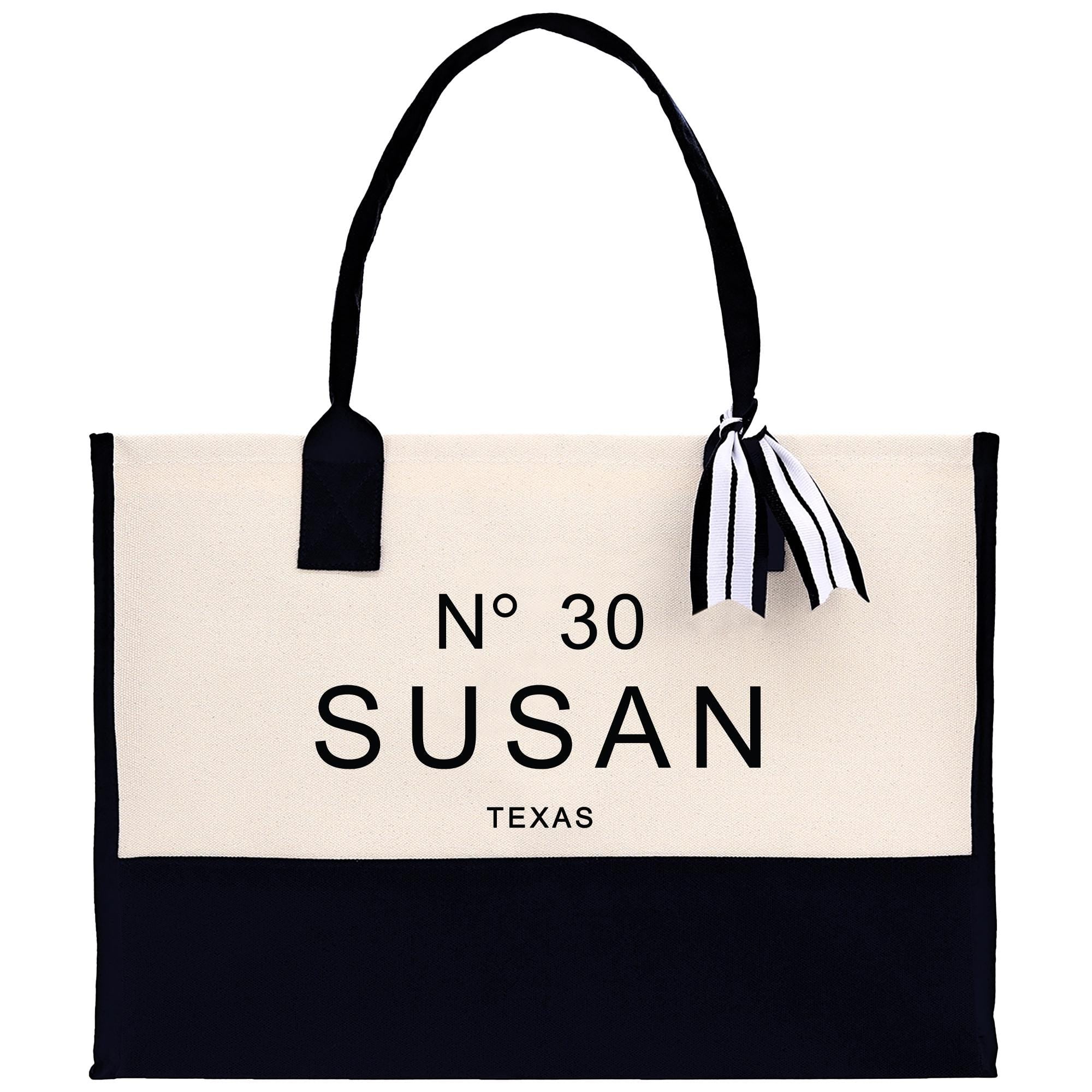 A black and white tote bag with the text &quot;No 30 Susan&quot; printed on it.