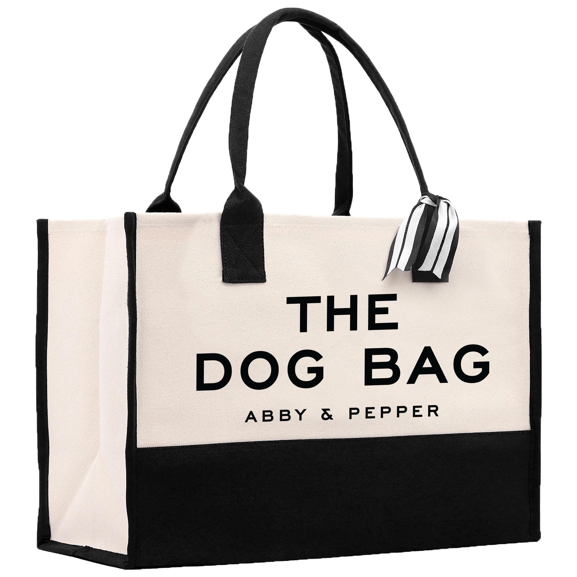 a black and white bag with the dog bag logo on it