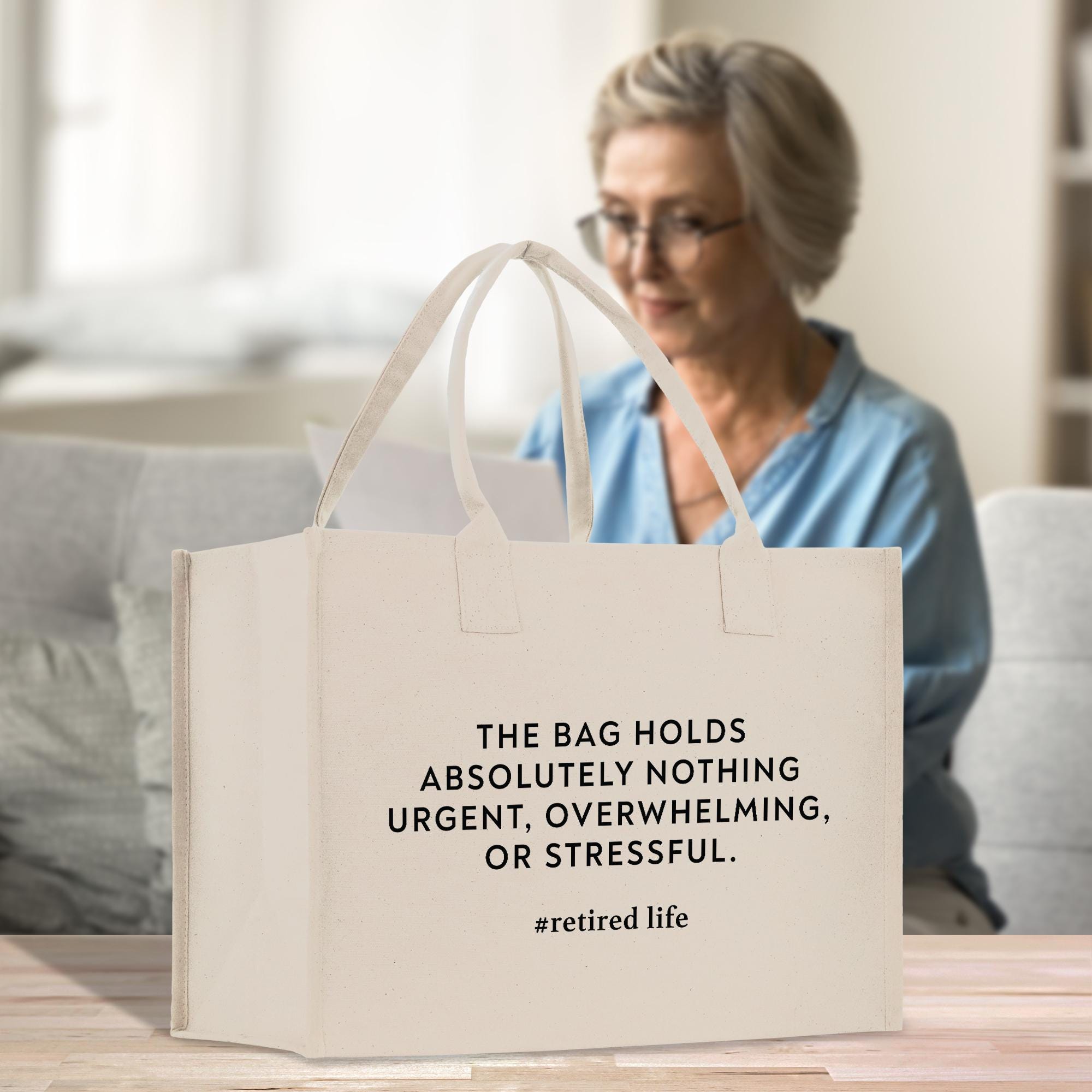 a woman sitting at a table with a bag in front of her