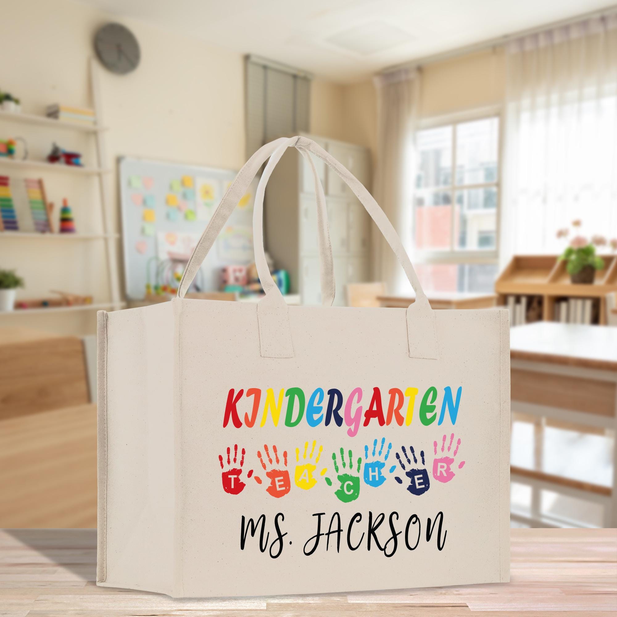 a white bag with hand prints on it sitting on a table