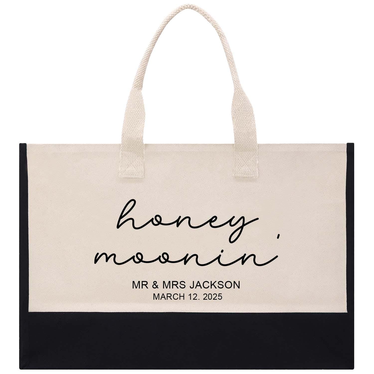 a black and white shopping bag with the words honey moon on it