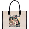 a bag with a picture of a woman reading a book