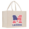 a white shopping bag with the letter m on it