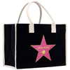 A black tote bag with a pink star-shaped logo on it.