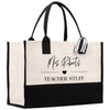 a black and white tote bag with a teacher stuff tag