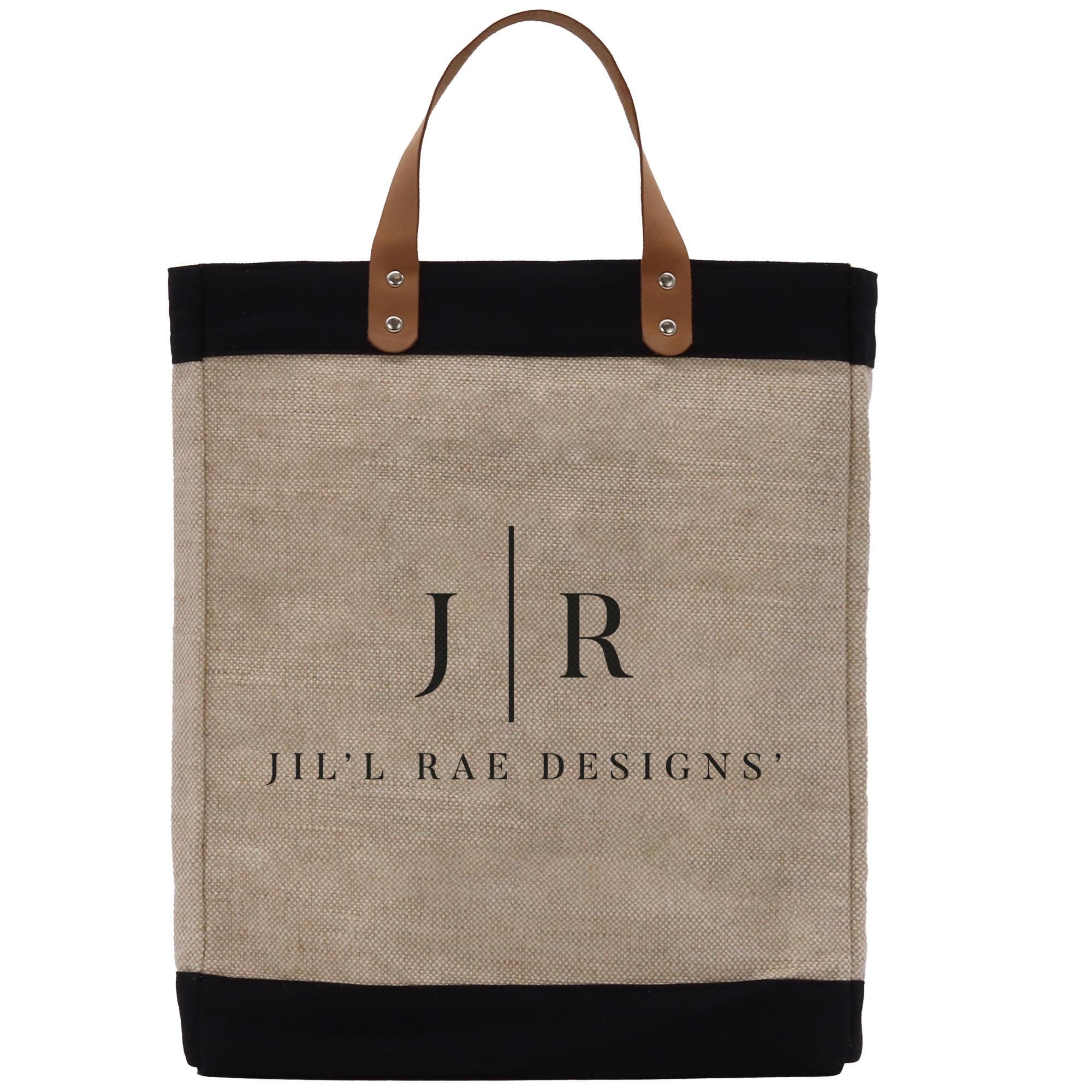 A beige tote bag with a black trim and leather handles, featuring the text &quot;Jil&#39;l Rae Designs&quot; printed on it.