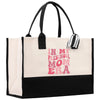 a black and white bag with a pink print on it