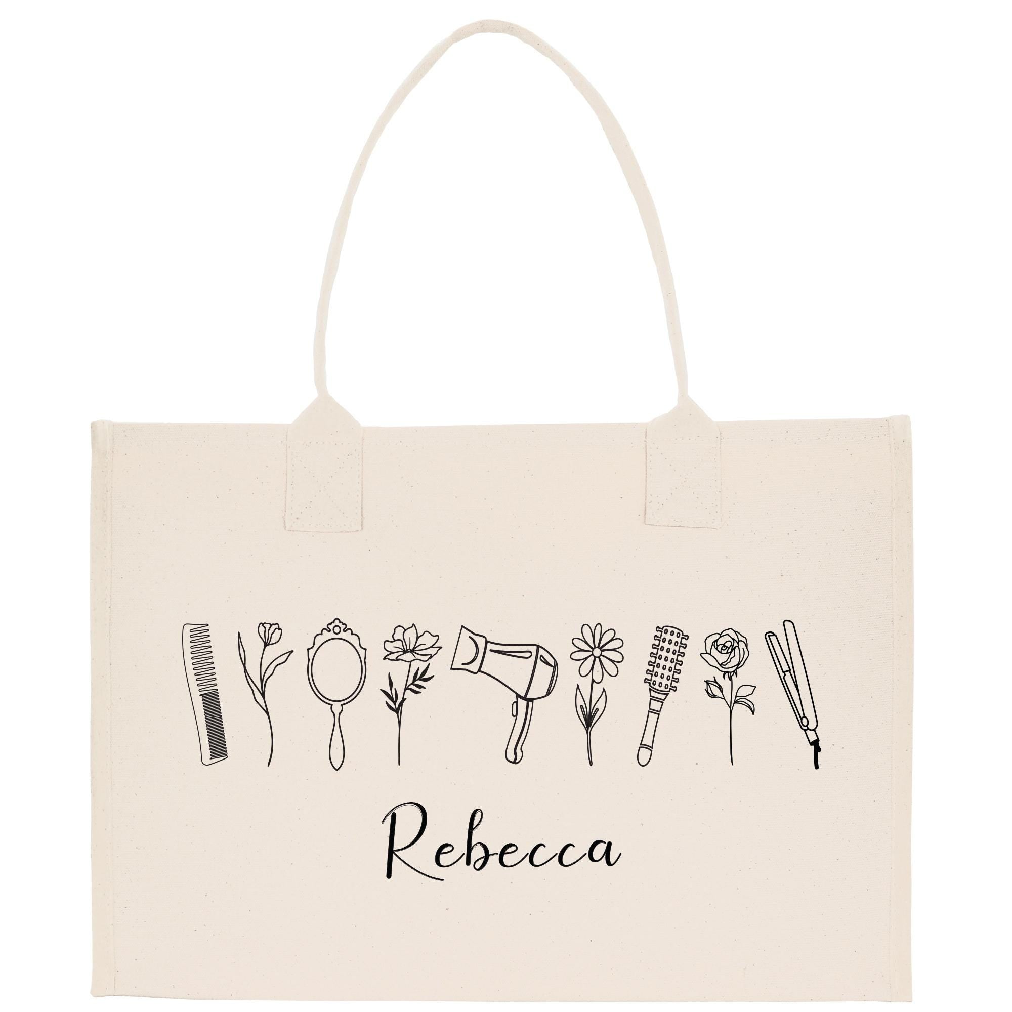 A beige canvas tote bag with a hand-drawn line art design of various hair styling tools and accessories, including a hair dryer, straightener, brush, and scissors, along with the name &quot;Recca&quot; written below.