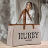 a white bag with the word hubby printed on it