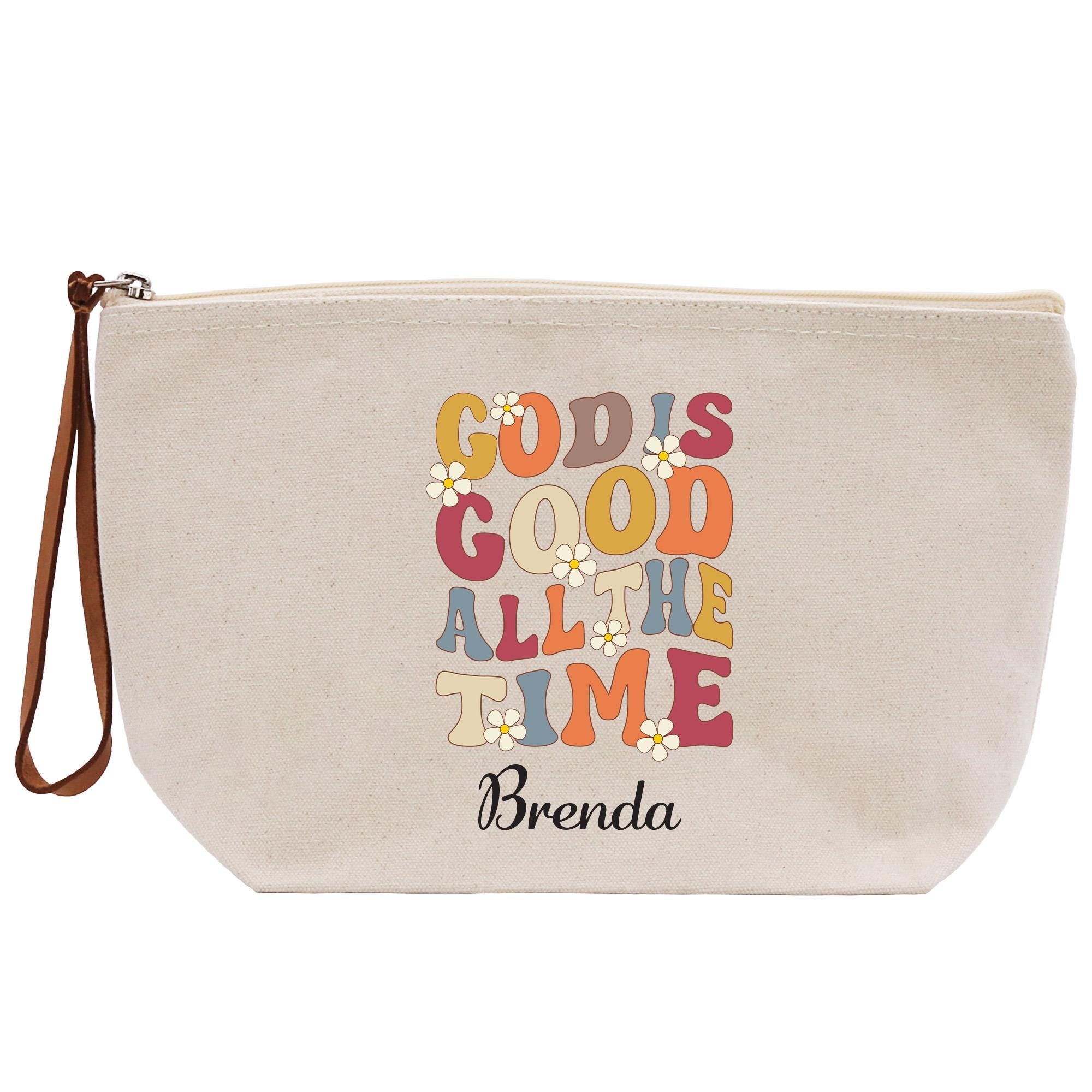 A beige canvas tote bag with a colorful text design printed on it.