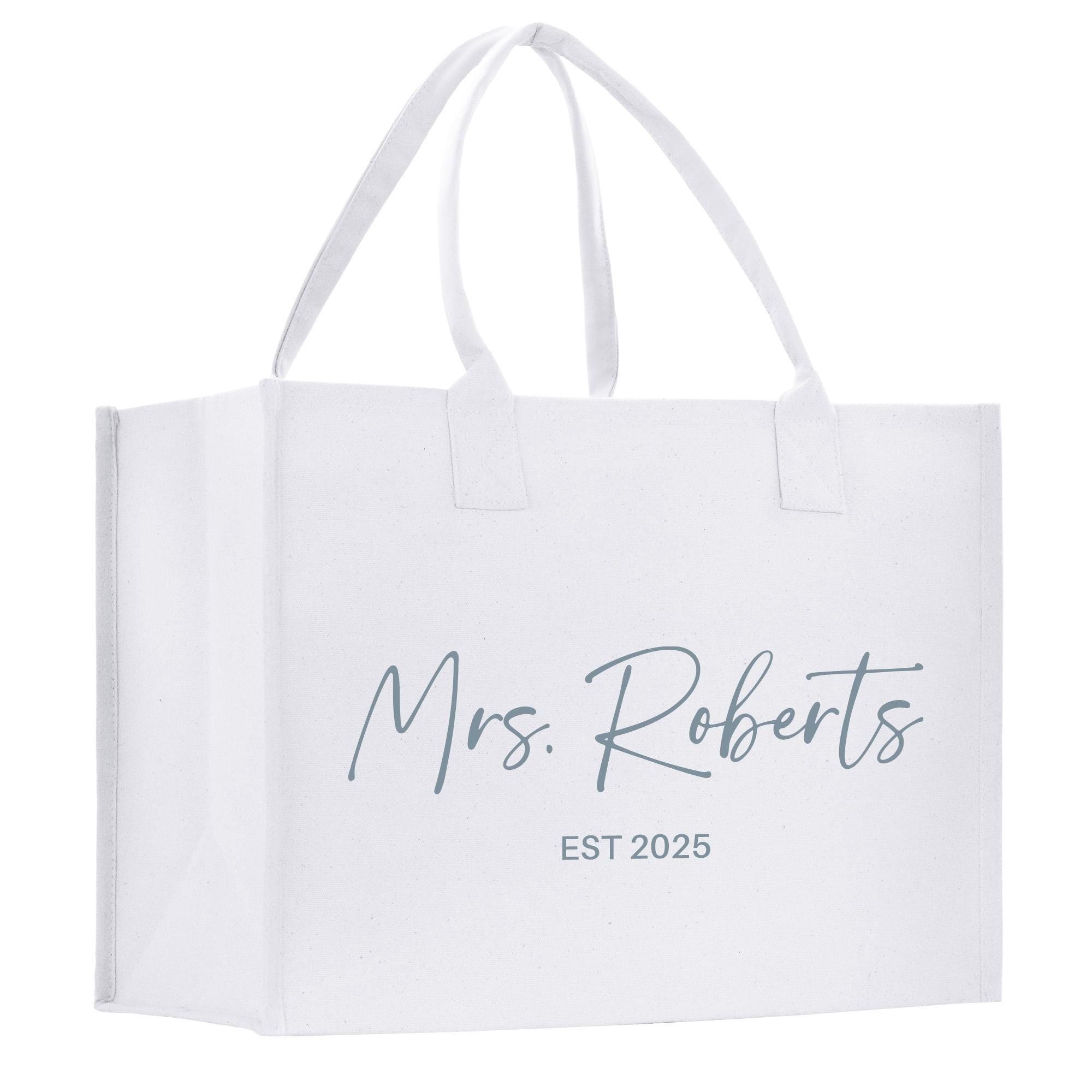 a white shopping bag with the words mrs roberts on it