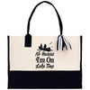 A tote bag with a black and white design, featuring a boat and the text 