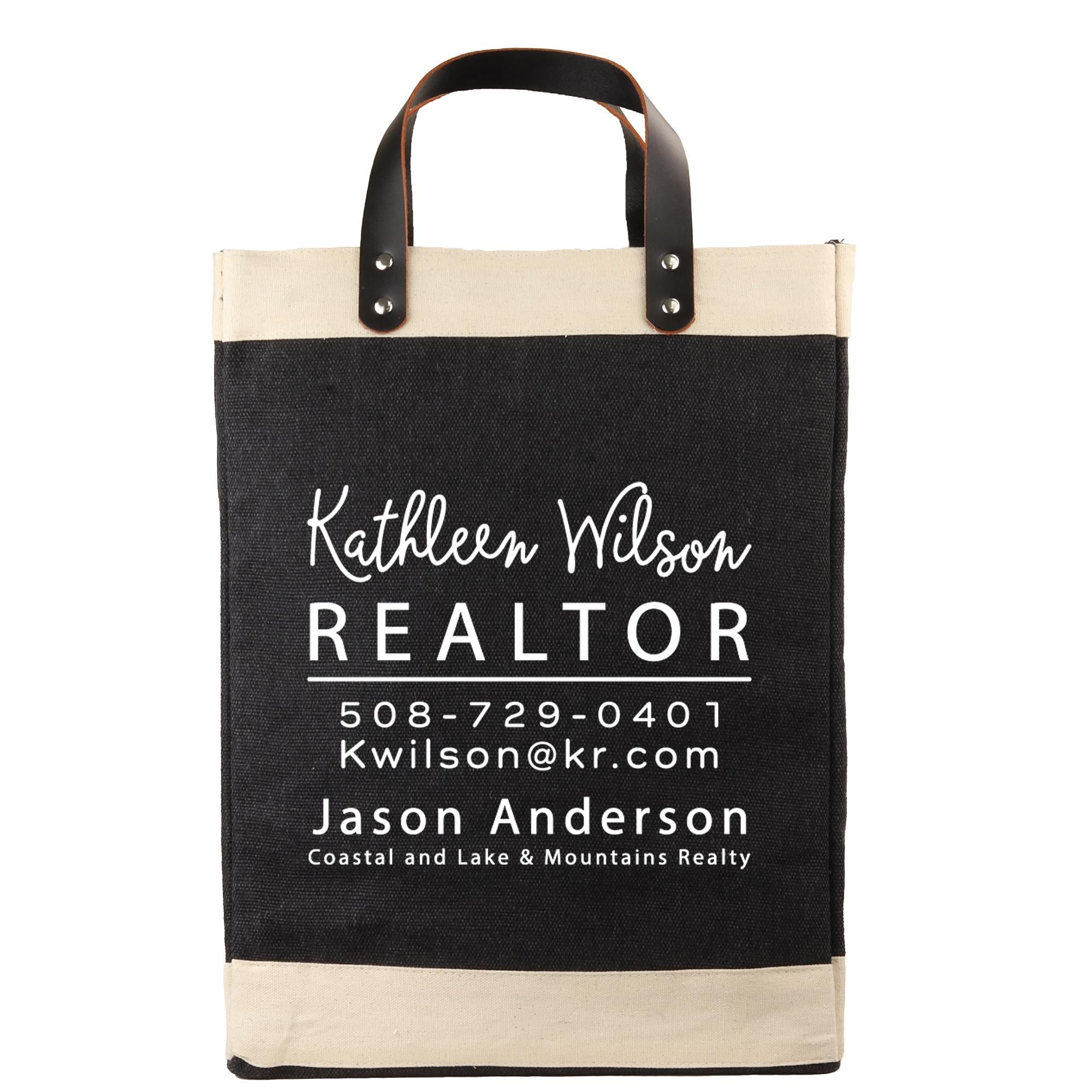 A black and beige tote bag with white text and contact information for a real estate agent named Kathleen Wilson.