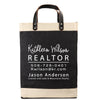 A black and beige tote bag with white text and contact information for a real estate agent named Kathleen Wilson.