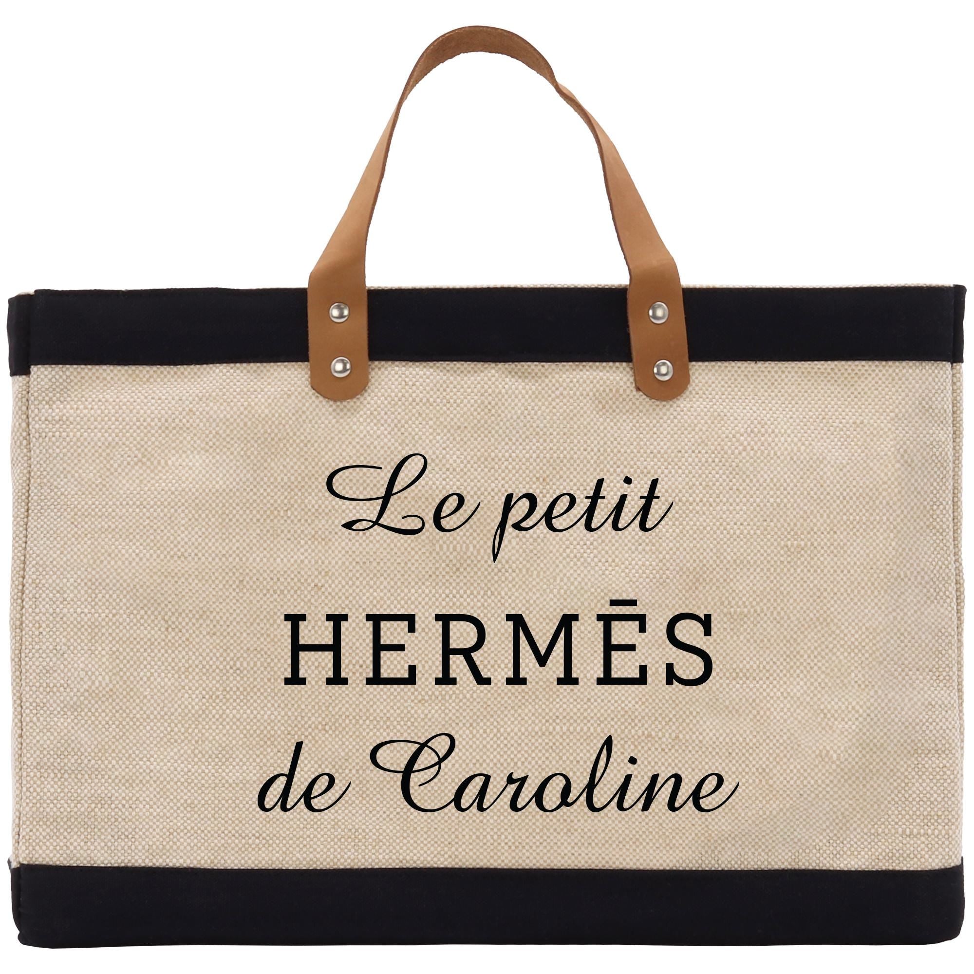 a black and white bag with a leather handle
