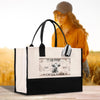 A large tote bag with a printed design on it, featuring a cow and the text "GEORGE PASO, CALIFORNIA" and "Cattle Ranch". In the background, there is a blurred image of a woman wearing a hat and glasses.