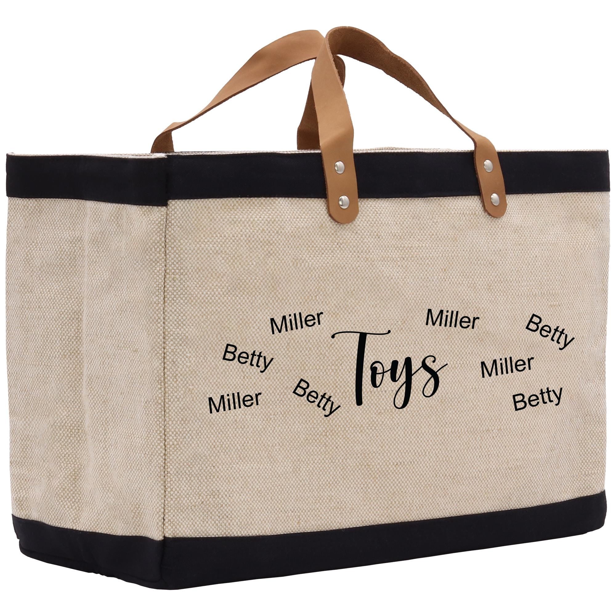 a canvas tote bag with a leather handle