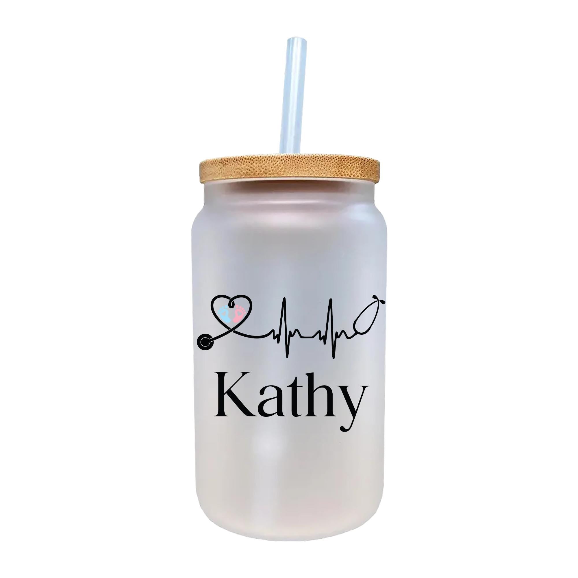a glass cup with a straw in it