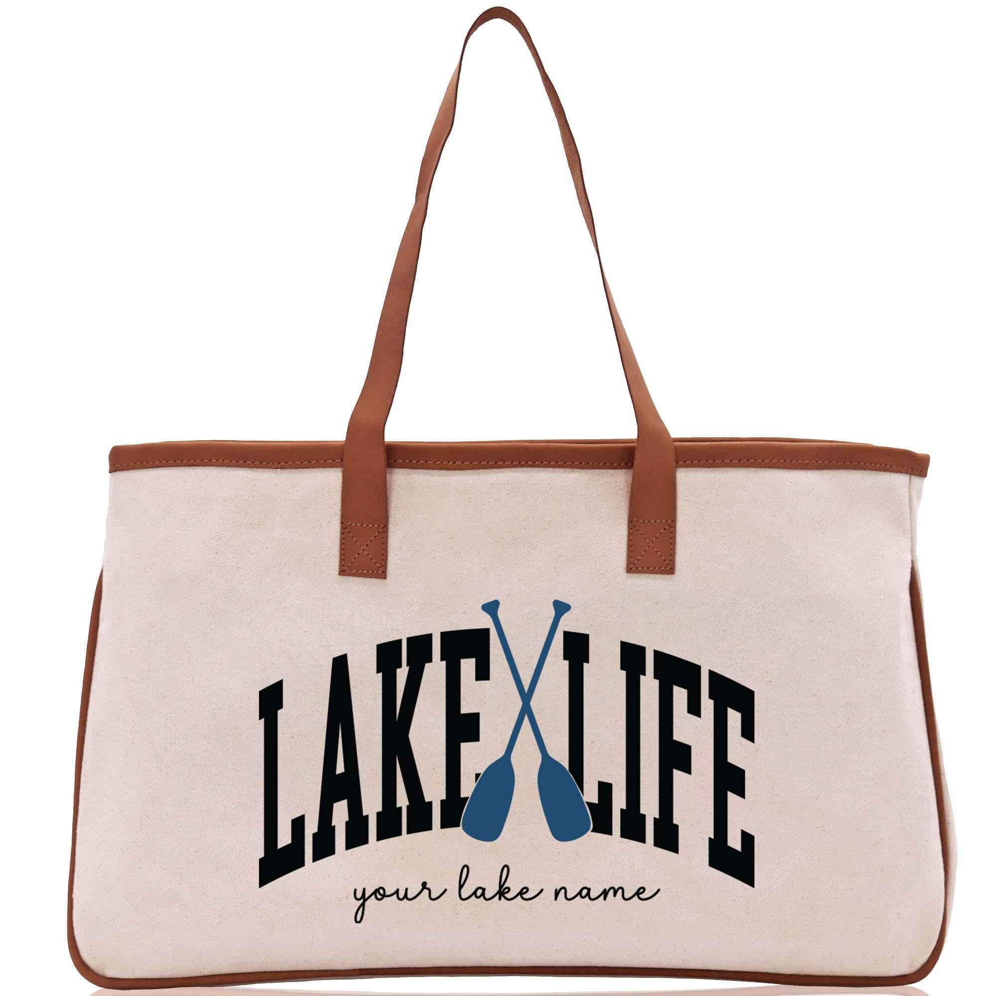 a white bag with a brown handle and a lake life logo on it