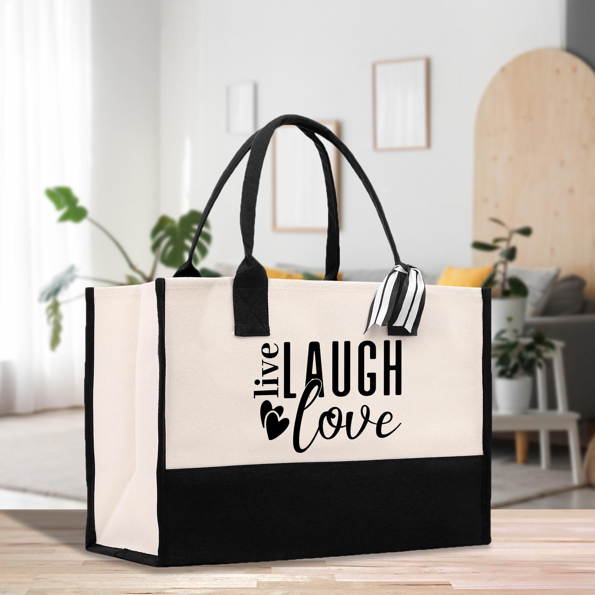 a black and white bag sitting on top of a wooden table