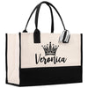 A large tote bag with a black and white color scheme, featuring a crown design and the name "Veronica" printed on it.