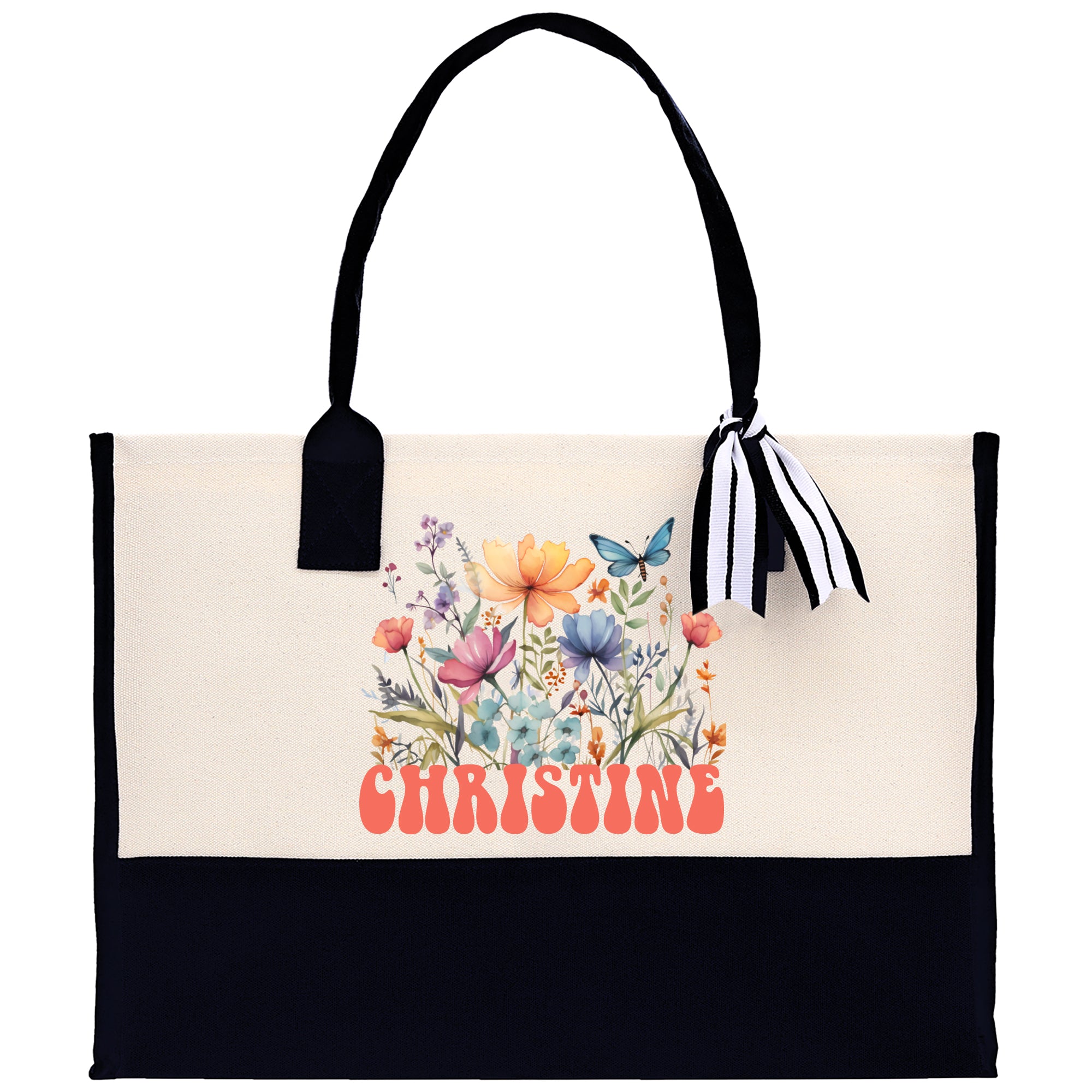 a black and white bag with flowers and butterflies on it