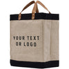 A beige tote bag with black trim and leather handles, featuring the text "YOUR TEXT OR LOGO" printed on it.