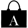 a black and white bag with a letter on it