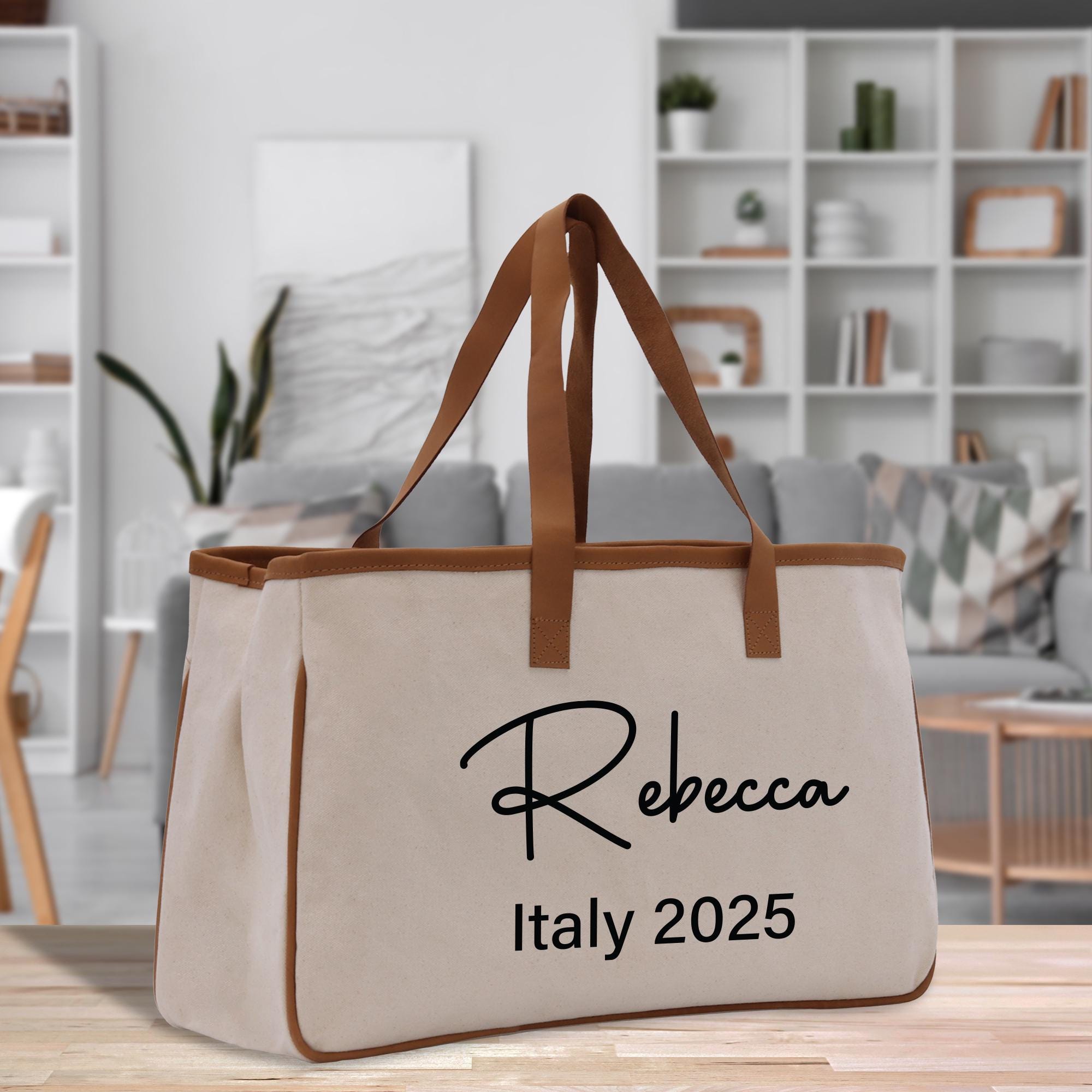 a white bag with a brown handle on a table