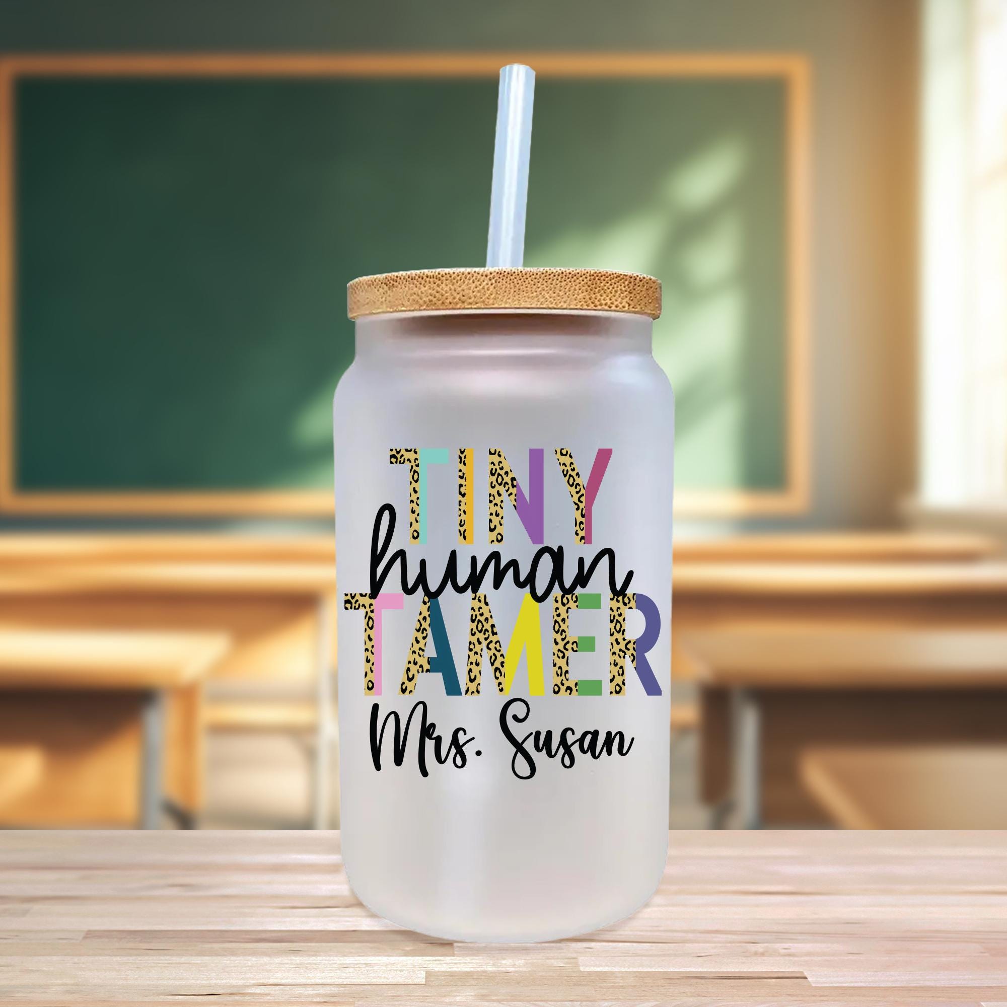 a glass with a straw in it sitting on a table