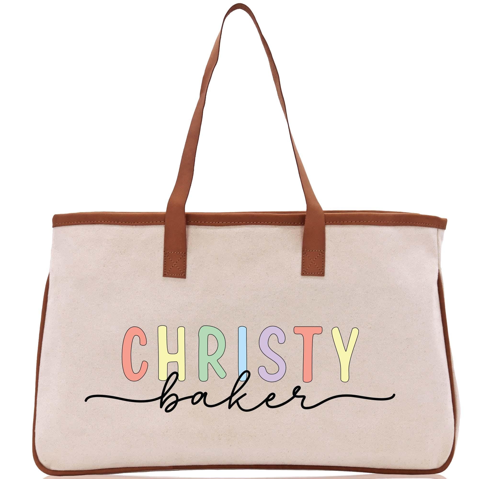a white bag with a brown leather handle