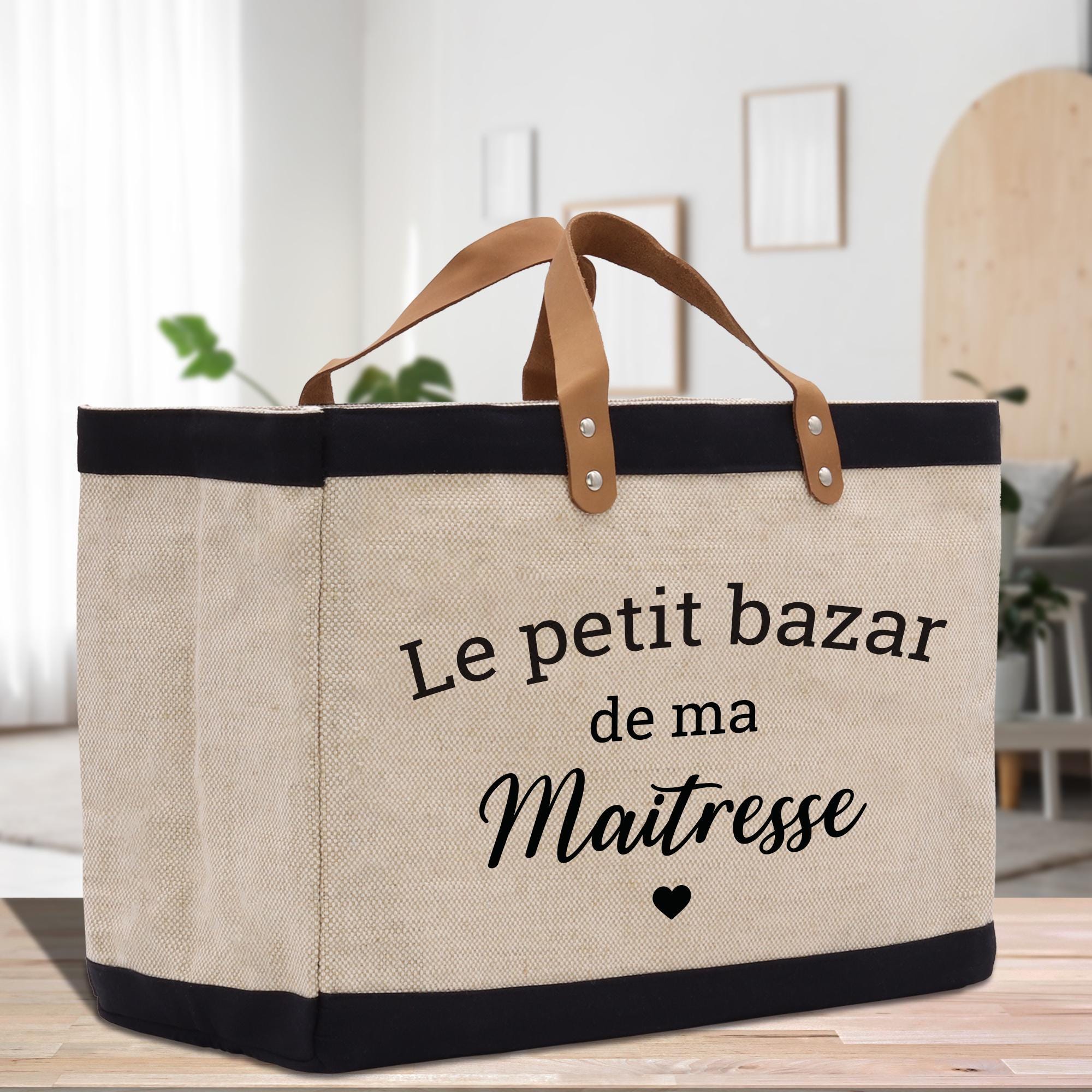 a canvas bag with a leather handle that says le petit bazar de ma