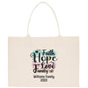 A beige canvas tote bag with a printed design that says "I Faith Hope Love Family" and "Williams Family 2035".