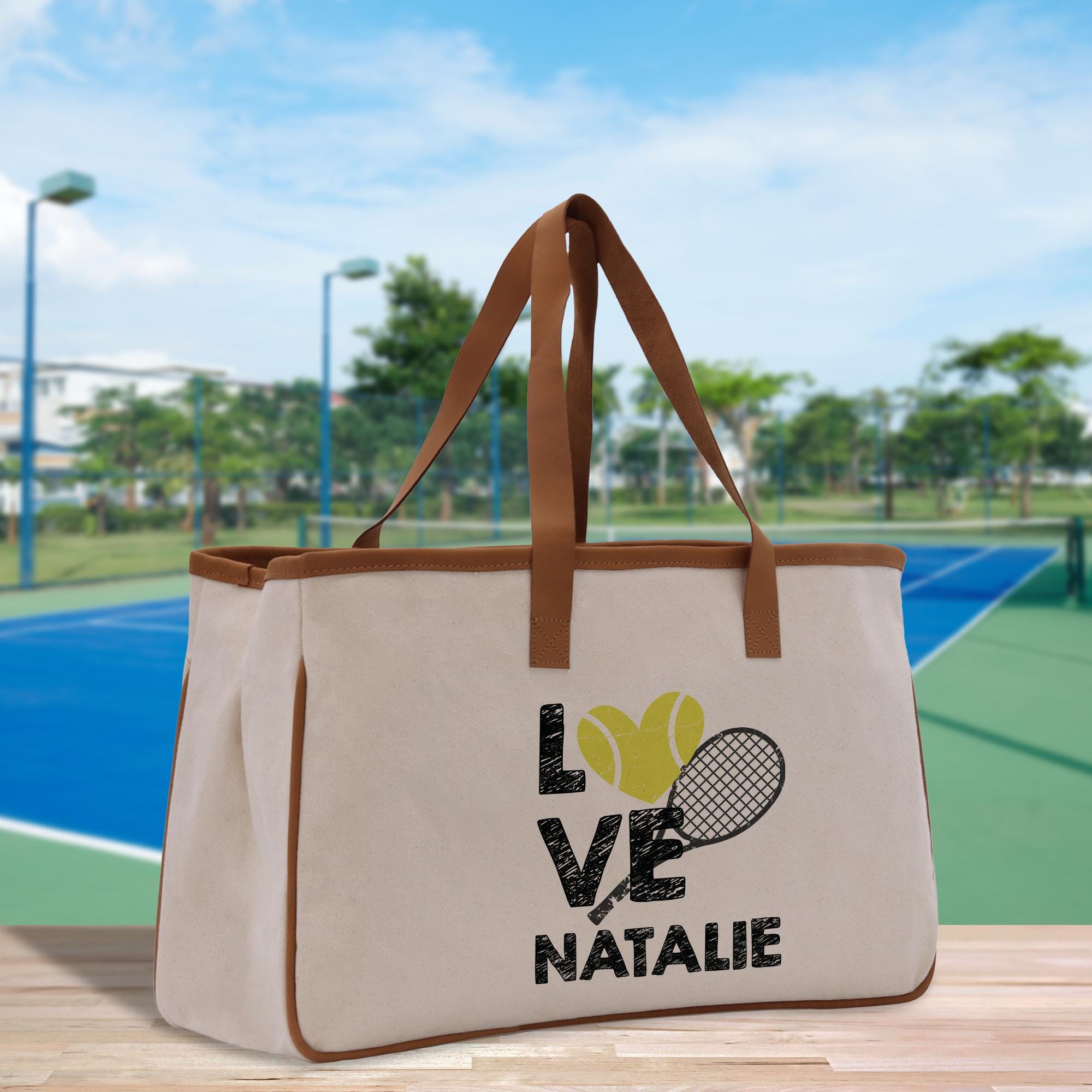 a canvas bag with a tennis ball and racquet on it