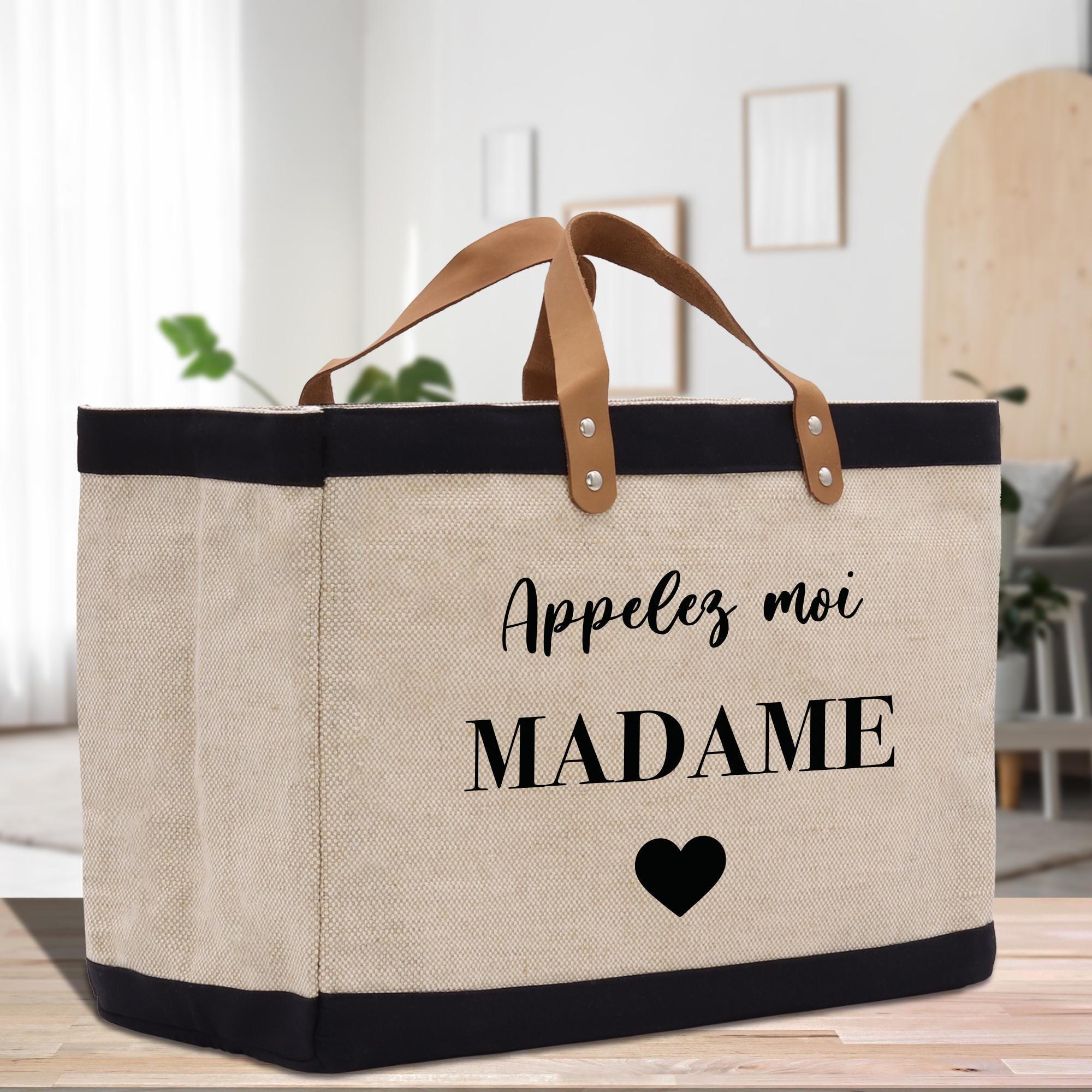 a canvas bag with a black heart on it