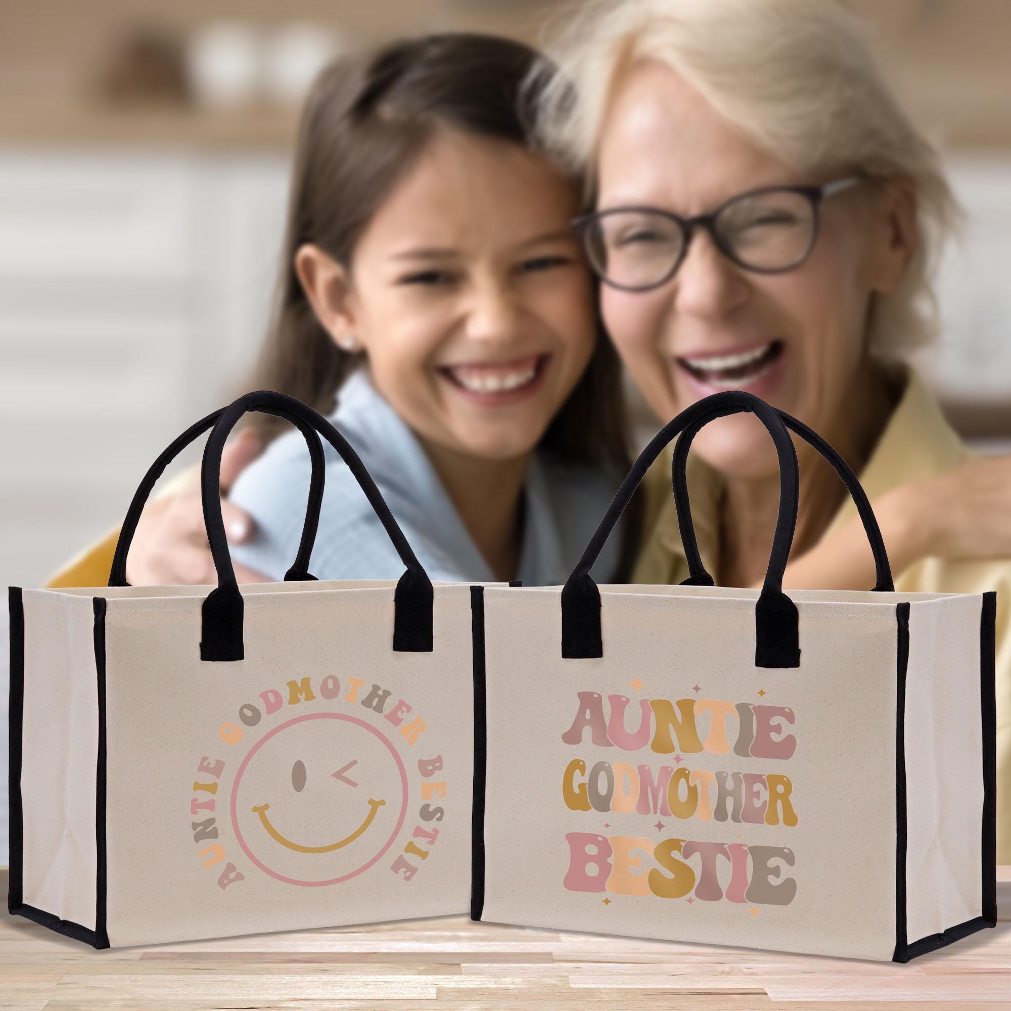 an older woman and a young girl are looking at a shopping bag