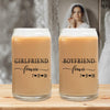 Two glass candle holders with text that says "GIRLFRIEND" and "BOYFRIEND" on them, along with the dates "7/21/25" and "7/21/25" printed below.