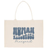 A beige tote bag with the text "HUMAN RESOURCES MARGARET" printed on it in a stylized font.