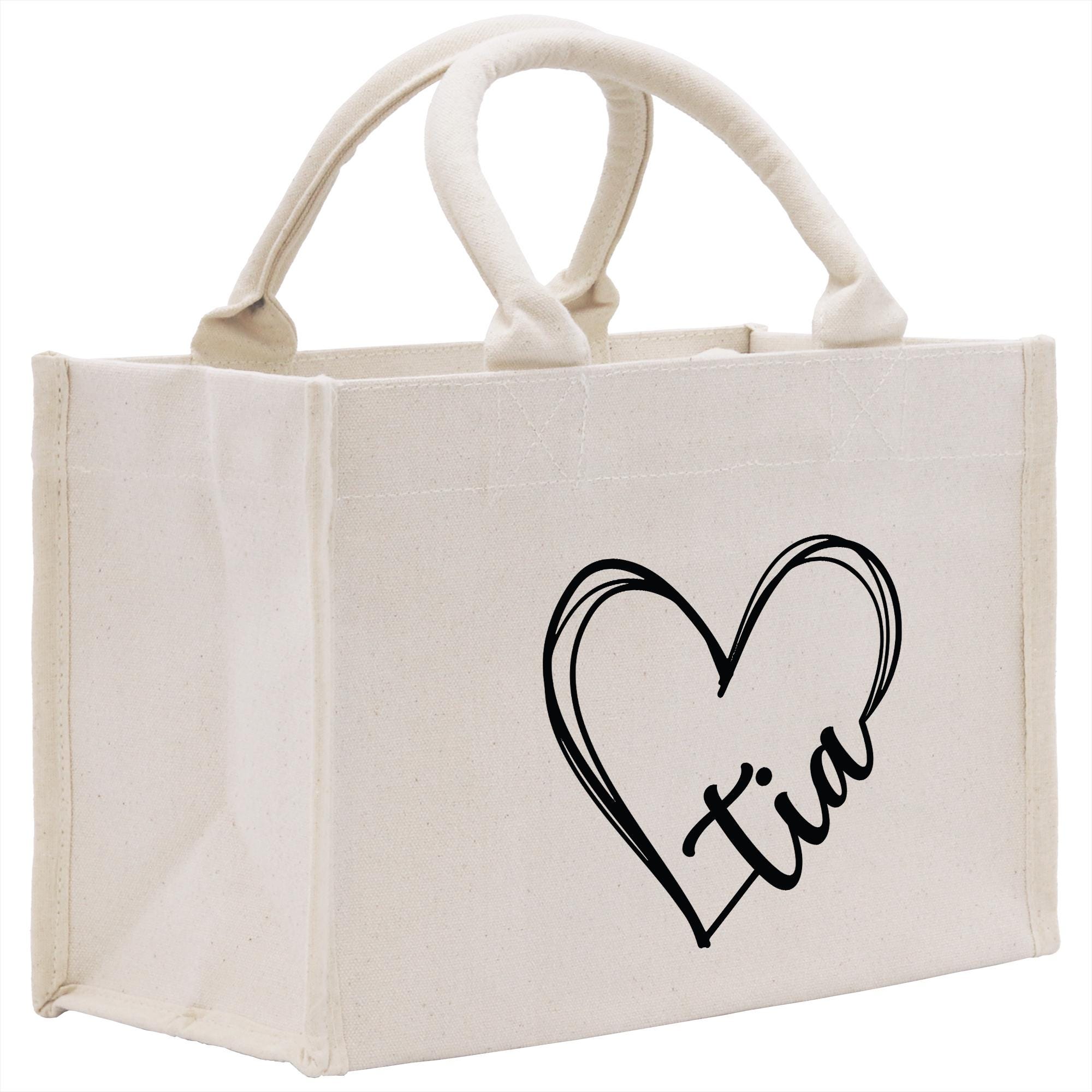 a canvas bag with a heart and the word i love you printed on it