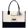 a black and white bag with a striped handle