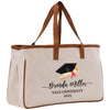 A beige tote bag with a graduation cap and mortarboard on it, printed with the text "Benda Miller Yale University 2025".
