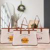 three bags with the name of the bride and the name of the groom