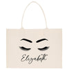 a white bag with eyelashes and eyelashes on it