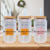 three bottles with straws are sitting on a table