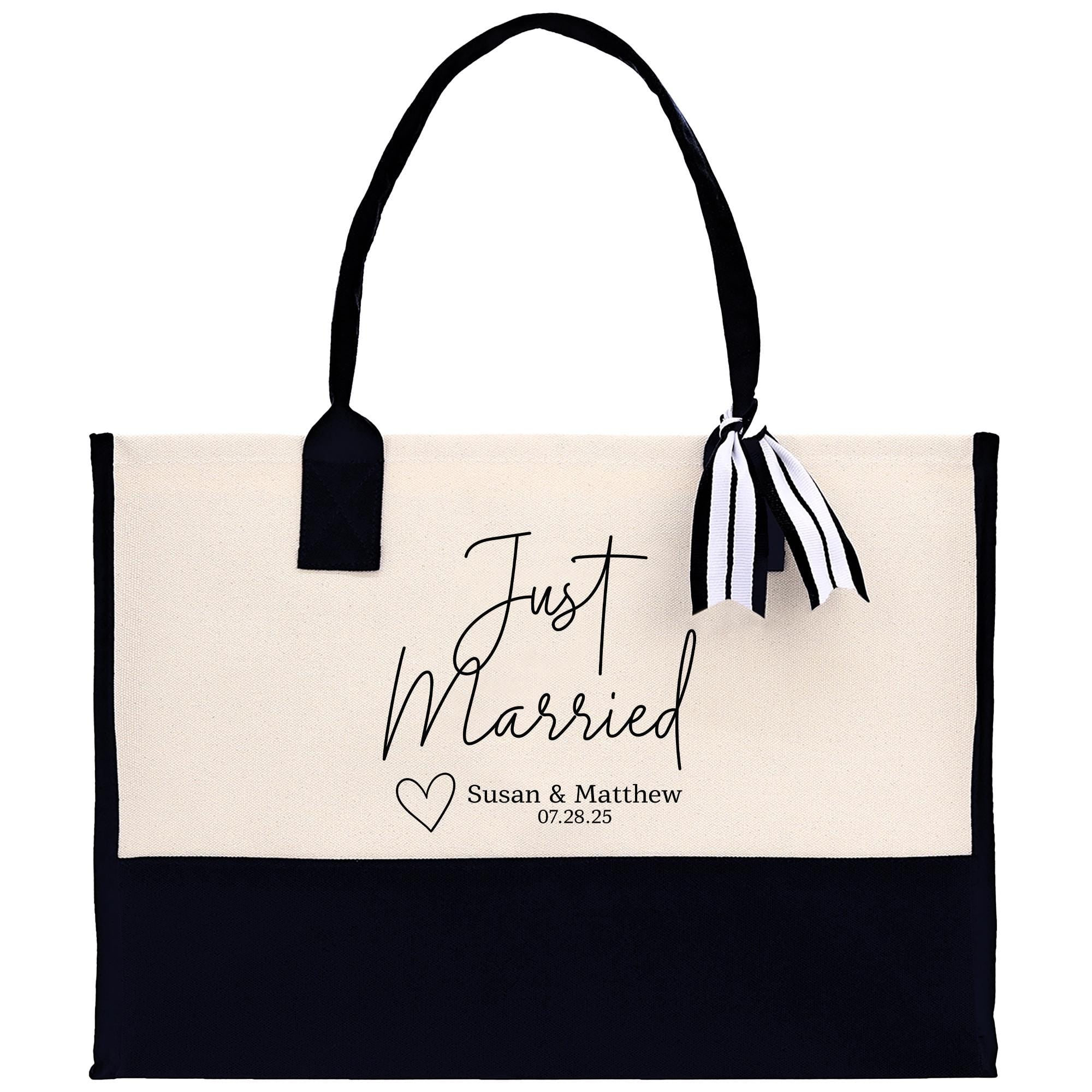 A tote bag with a black and white design, featuring the text &quot;Just Married Susan & Matthew 07.28.25&quot; printed on it.