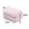 A pink makeup case with a zipper closure and a small tag hanging from the zipper.