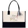 a black and white bag with flowers on it
