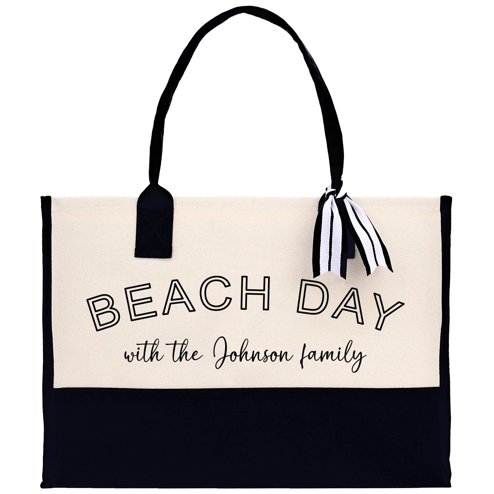 a black and white beach bag with the words beach day with the johnson family